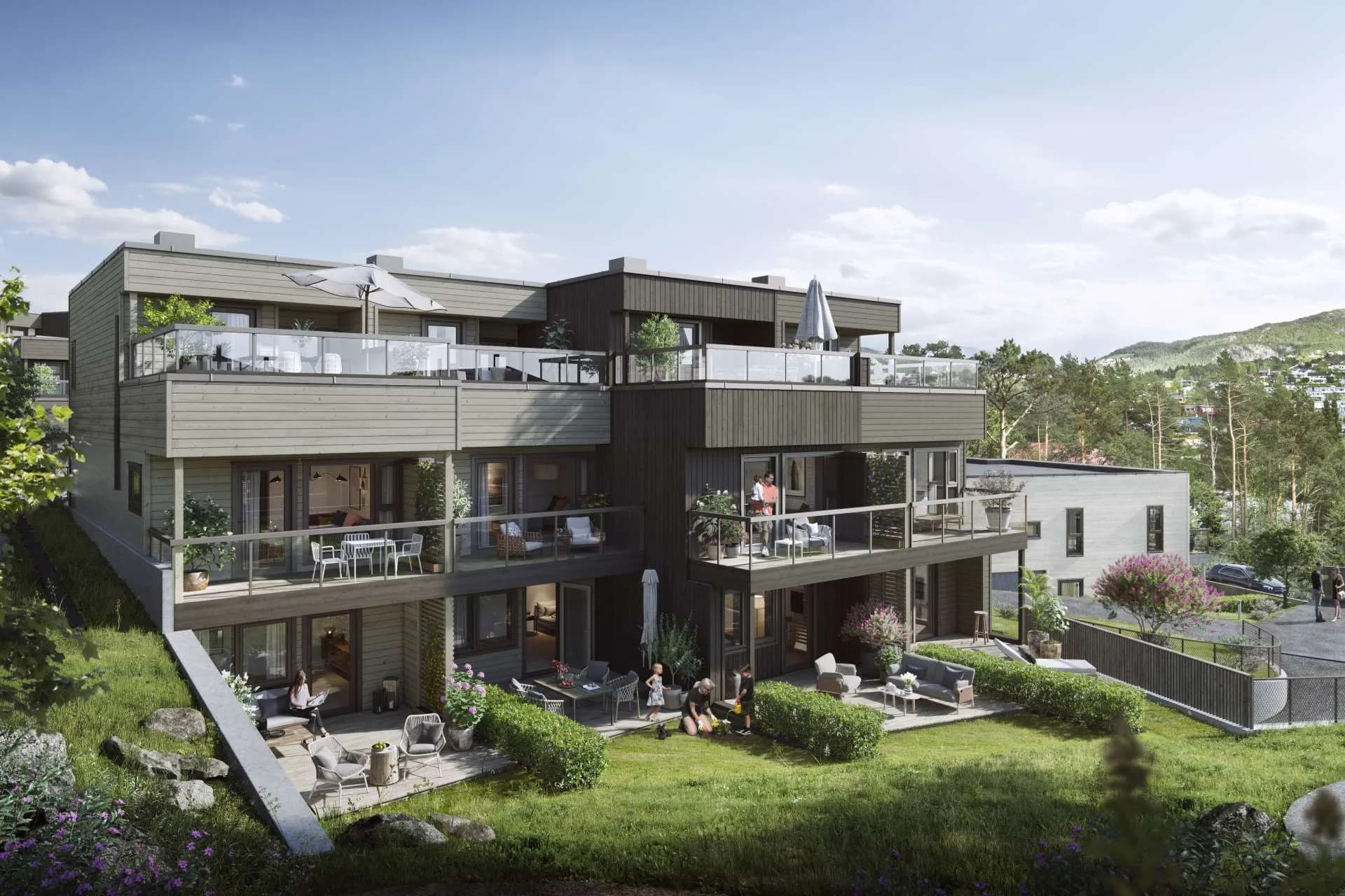 Terrasseleiligheter i skrånende terreng med grønne uteområder