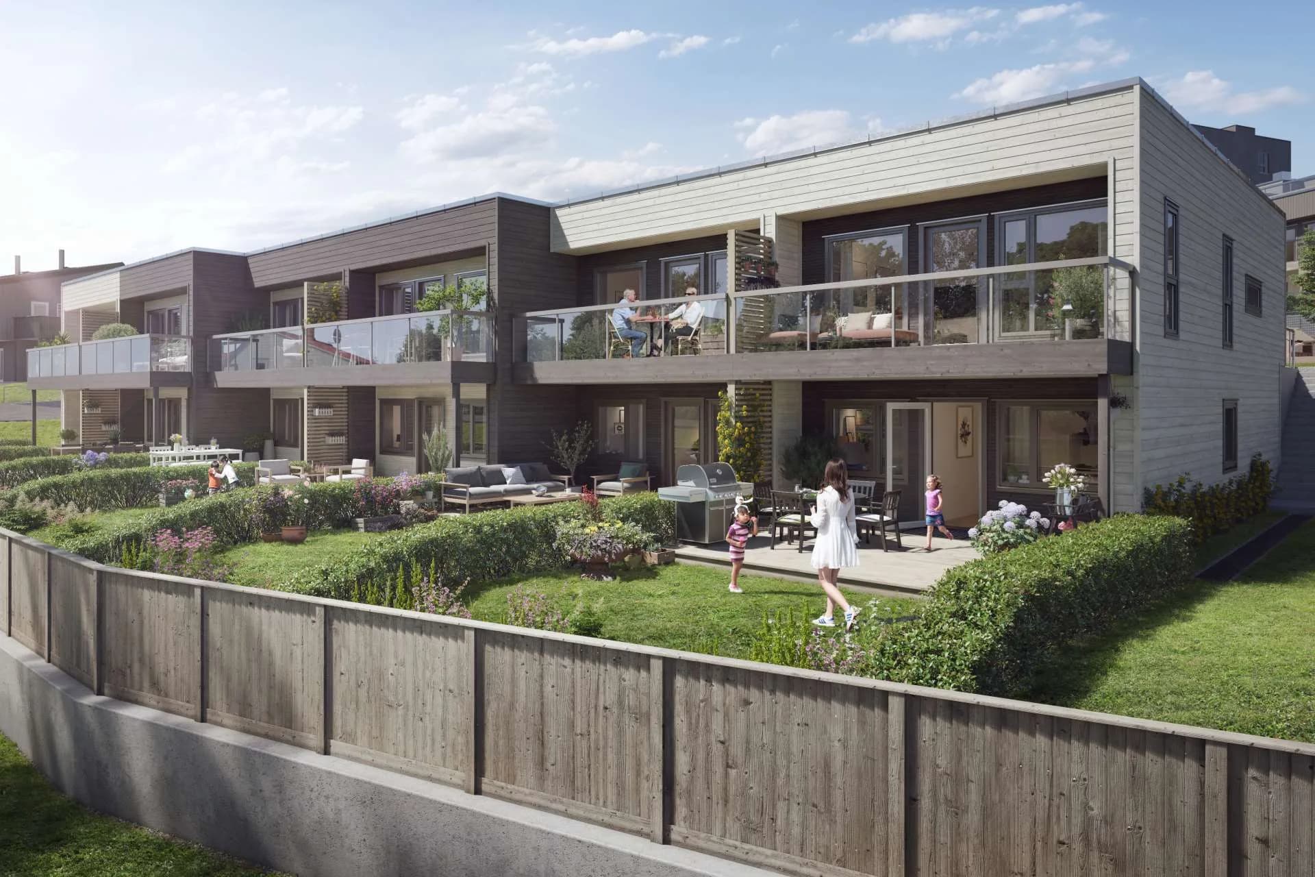 Rekke av leiligheter med terrasser og felles hage